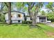 Lovely home framed by mature trees, presenting a well-manicured lawn and inviting curb appeal at 1944 Galeston Ct, Indianapolis, IN 46229