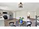 Well-lit kitchen featuring modern appliances, stylish cabinetry, and a dining space at 1944 Galeston Ct, Indianapolis, IN 46229