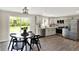 Modern kitchen with stainless steel appliances, sleek countertops, and an adjacent dining area at 1944 Galeston Ct, Indianapolis, IN 46229
