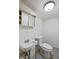 Functional basement bathroom with sink, toilet, and basic amenities at 2006 N Moreland Ave, Indianapolis, IN 46222