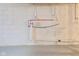 Basement wall with plumbing connections for future bathroom or laundry installations at 2006 N Moreland Ave, Indianapolis, IN 46222