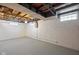 Spacious unfinished basement, featuring painted walls, ready to be customized at 2006 N Moreland Ave, Indianapolis, IN 46222