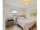 Serene bedroom featuring a plush bed, modern nightstand, and bright windows at 2006 N Moreland Ave, Indianapolis, IN 46222