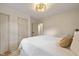 Comfortable bedroom featuring neutral decor, hardwood floors, and double closets at 2006 N Moreland Ave, Indianapolis, IN 46222
