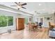 Bright dining room area with natural light, wood floors, ceiling fans and a cozy atmosphere at 217 Devonshire Ct, Anderson, IN 46013
