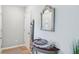 Bright foyer with neutral walls, decorative mirror, and sleek table display at 217 Devonshire Ct, Anderson, IN 46013