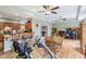 Spacious open-plan living area with hardwood flooring, abundant natural light, and eat-in kitchen at 217 Devonshire Ct, Anderson, IN 46013
