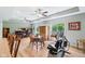 Open living and dining area featuring hardwood floors, tray ceiling, and lots of windows at 217 Devonshire Ct, Anderson, IN 46013