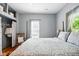 Cozy bedroom with hardwood floors, natural light, and four poster bed at 218 Pearl St, Fortville, IN 46040