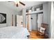 Charming bedroom with hardwood floors, natural light, and built-in shelves at 218 Pearl St, Fortville, IN 46040