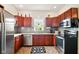 Efficient kitchen featuring stainless steel appliances, tiled backsplash, and ample counter space at 218 Pearl St, Fortville, IN 46040