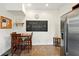 Cozy kitchen with chalkboard accent wall, wooden table and stainless steel refrigerator at 218 Pearl St, Fortville, IN 46040
