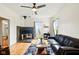 Cozy living room featuring hardwood floors, a slate fireplace, and a comfortable leather couch at 218 Pearl St, Fortville, IN 46040