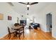 Inviting living room features hardwood floors, fireplace, ceiling fans, and comfortable seating at 218 Pearl St, Fortville, IN 46040