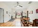 Open-concept living room and dining area featuring hardwood floors, and a bay window at 218 Pearl St, Fortville, IN 46040