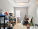 The storage room has carpeted floors and shelves stocked with a variety of items at 218 Pearl St, Fortville, IN 46040