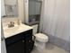 Bathroom featuring sink and vanity, toilet and shower with gray cabinets at 230 Kiawah Dr, Whiteland, IN 46184