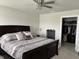 Bedroom with a large bed and open closet space with built-in organizers at 230 Kiawah Dr, Whiteland, IN 46184