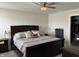 Bedroom with a large bed, bedside tables, and crystal light fixture at 230 Kiawah Dr, Whiteland, IN 46184