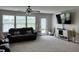 Comfortable living room features a fireplace, flat screen tv, and a water view at 230 Kiawah Dr, Whiteland, IN 46184
