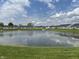 Scenic pond view from the community with lush green surroundings at 230 Kiawah Dr, Whiteland, IN 46184
