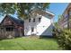Exterior view of home with a well-maintained backyard and sunny skies at 2442 Guilford Ave, Indianapolis, IN 46205