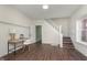 Inviting entryway boasting wood floors and staircase, offering a warm welcome into the home at 2442 Guilford Ave, Indianapolis, IN 46205