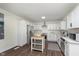 Bright kitchen with white cabinets, stainless steel appliances, subway tile backsplash and center island at 2442 Guilford Ave, Indianapolis, IN 46205