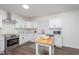 Modern kitchen featuring white cabinets, stainless steel appliances, and a functional island at 2442 Guilford Ave, Indianapolis, IN 46205