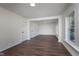 Neutral living space with wood-look floors, freshly painted walls and bright sunny windows at 2442 Guilford Ave, Indianapolis, IN 46205