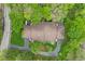 Aerial perspective showcases a home's roof nestled within lush green trees, offering a serene setting at 2922 Amherst St, Indianapolis, IN 46268