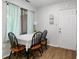 The dining area features a sliding door and a table with four chairs at 2922 Amherst St, Indianapolis, IN 46268