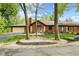Charming brick home with manicured landscaping and inviting entrance, with a circular driveway at 2922 Amherst St, Indianapolis, IN 46268