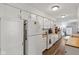 Bright kitchen featuring white cabinets, wooden countertops, appliances, and ample counter space at 2922 Amherst St, Indianapolis, IN 46268
