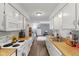 Functional kitchen with white cabinets, wooden countertops, and ample storage space, leading to a recreation room at 2922 Amherst St, Indianapolis, IN 46268