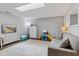 The playroom/living room boasts a skylight and neutral decor at 2922 Amherst St, Indianapolis, IN 46268