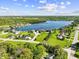 Beautiful aerial view showcases lakefront property with lush greenery, located on a desirable cul-de-sac at 3107 Waterfront Cir, Anderson, IN 46012