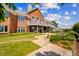 Spacious backyard featuring a patio, stone walkway, and upper deck at 3107 Waterfront Cir, Anderson, IN 46012