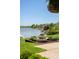 Backyard view of a decorative fountain and glimpses of the lake beyond at 3107 Waterfront Cir, Anderson, IN 46012