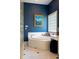 Tranquil bathroom featuring a corner soaking tub, glass block accents and tiled flooring at 3107 Waterfront Cir, Anderson, IN 46012