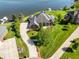 Luxury waterfront home featuring manicured landscaping and a long private driveway at 3107 Waterfront Cir, Anderson, IN 46012