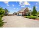 Stately brick home features an attached garage and circular driveway at 3107 Waterfront Cir, Anderson, IN 46012