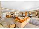 Expansive living room features unique decor, games, and a cozy seating area for entertaining guests at 3107 Waterfront Cir, Anderson, IN 46012