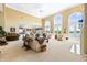 Spacious living room boasts high ceilings, large windows, and an open layout, perfect for entertaining at 3107 Waterfront Cir, Anderson, IN 46012
