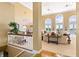 Inviting living area offering a glimpse of the adjacent sitting room and dining area from the staircase at 3107 Waterfront Cir, Anderson, IN 46012