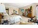 Relaxing main bedroom with a fireplace, built-in bookshelves, and comfortable seating area at 3107 Waterfront Cir, Anderson, IN 46012