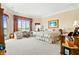 Spacious main bedroom features a bay window, water views, and plush neutral carpeting at 3107 Waterfront Cir, Anderson, IN 46012
