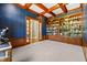 Well-appointed office with custom wood shelving and trim, offering a sophisticated and functional workspace at 3107 Waterfront Cir, Anderson, IN 46012