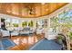 Charming sunroom with wood ceiling, lots of windows, and comfortable seating at 3107 Waterfront Cir, Anderson, IN 46012