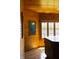 Cozy sunroom with wooden paneling and view of the lake at 3107 Waterfront Cir, Anderson, IN 46012